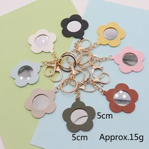 Flower-shaped PU leather mirror keychain set in 8 colors with metallic clasp, 5cm diameter