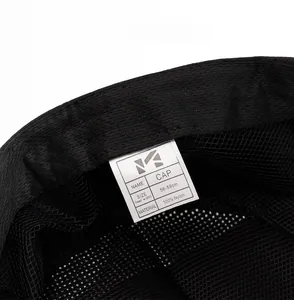 Detail view of breathable mesh lining and 100% nylon material label of the summer sun cap