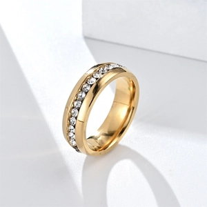 Polished gold stainless steel ring with single row of cubic zirconia stones