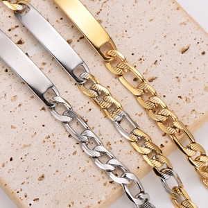 Mens fashion stainless steel Figaro ID bracelet in gold and silver on beige stone
