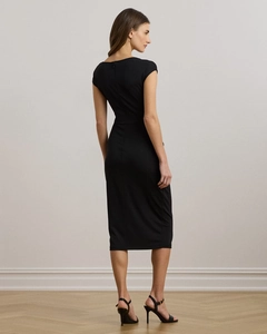 Rear view of sleek black slim fit midi dress featuring an elegant back zipper closure