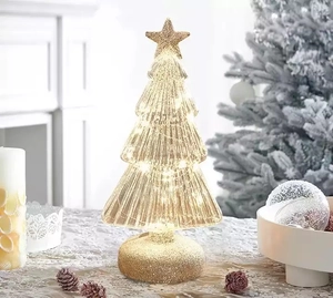 Golden LED glass Christmas tree topper with star finial and festive warm lights