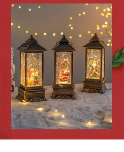 Three vintage Christmas lanterns with snowmen and Santa Claus featuring warm LED lighting