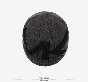 Top view of dark grey knit beanie with black geometric patterns and ribbed edge details
