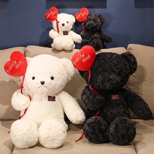 Detailed view of black and white teddy bears with rose texture fur and red hearts