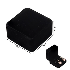 Close-up of black velvet jewelry box showing 7x7x4cm dimensions for rings and earrings