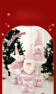 Detail of pink sequin Christmas dolls with retractable legs for festive window display