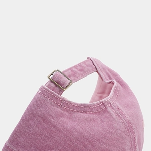 Vintage washed pink cotton baseball cap with adjustable metal buckle back closure