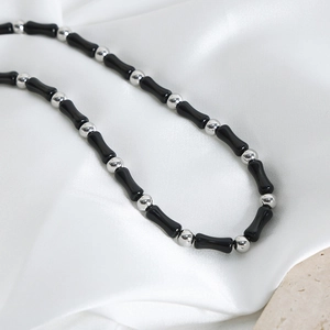 Handmade necklace with black agate bamboo beads and silver spherical beads on silk