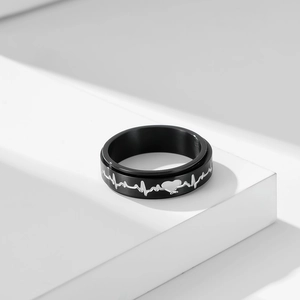 Bague rotative en acier inoxydable noir avec motif d'électrocardiogramme argenté