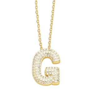 Detailed view of a gold initial G pendant necklace featuring sparkling white crystals