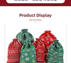 Detail of red and green burlap Christmas gift bags with reindeer prints and gold foil text