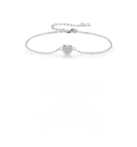Macro shot of 925 silver heart bracelet with shimmering pavé diamonds and lobster clasp