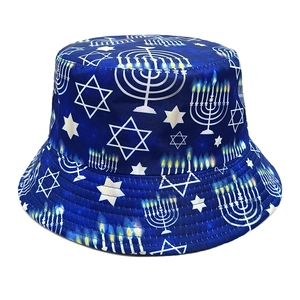 Detail view of navy bucket hat featuring Menorah and Star of David print patterns