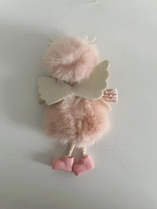 Detail of pink plush angel Christmas tree ornament with glitter wings and tiny boots