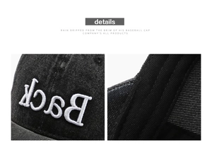 Detail of high-quality white 3D embroidery showing Back on washed black baseball cap