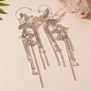 Elegant silver butterfly ear cuff with sparkling rhinestone tassels and luxury crystals