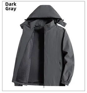 Detail of dark grey windbreaker featuring breathable mesh lining and elastic cuffs
