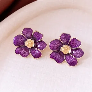 French vintage purple enamel flower earrings with a detailed golden rose center