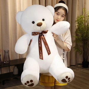 Large white teddy bear plush toy with brown bow tie and heart embroidery on paws