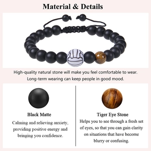Detail view of tiger eye and matte stone volleyball bracelet with material descriptions