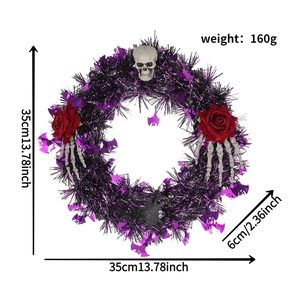 Detail view of a 35cm Halloween wreath with black and purple wire, skulls and red roses