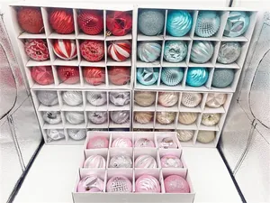 Detail of Christmas ornament set with glitter and matte baubles in 12-slot gift boxes