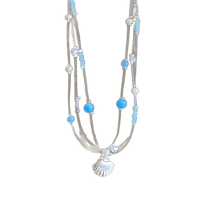 Blue beaded multi-layer necklace with a silver shell pendant in a vacation style
