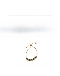 Detail view of adjustable gold-finish bracelet with green square zircons and size specs