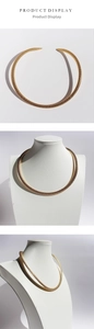 Detailed close-up showing the golden woven texture and semi-open snake chain choker design