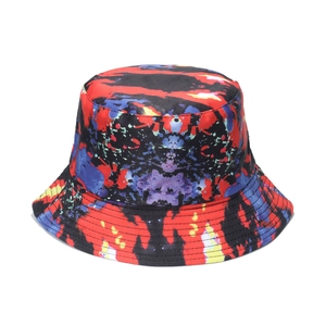 Macro view of 3D tie-dye bucket hat with vibrant red blue and yellow abstract pattern