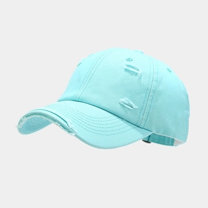 Detail view of distressed light blue baseball cap with frayed edges and adjustable buckle
