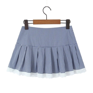 Detailed view of blue plaid pleated mini skirt with white lace hem and wood hanger