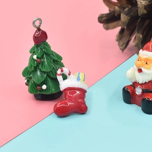 Miniature resin Christmas charms featuring Santa Claus, tree and sock for DIY crafts