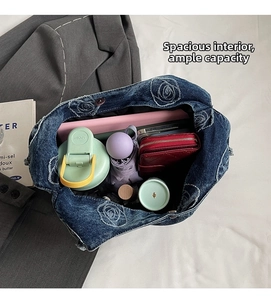 Macro detail of spacious denim tote bag interior showing large storage capacity for daily items