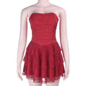 Detailed close-up of dark red tube dress featuring ruched bodice and layered lace skirt
