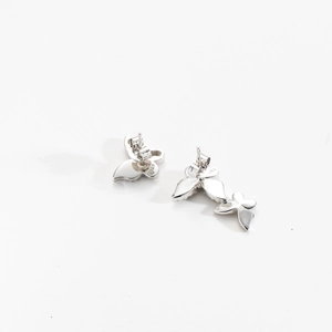 Macro detail of S925 sterling silver butterfly stud earrings with sparkling pave zircon
