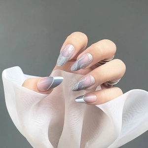 Haze blue and gray gradient pointed faux nails with silver glitter and white linear art