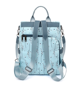 Back view of light blue oxford backpack showing adjustable straps and waterproof fabric