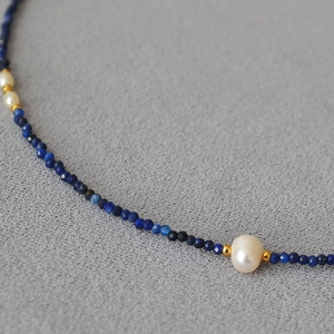 Minimalist lapis lazuli beaded necklace with small white freshwater pearls and gold spacers
