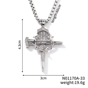 Detail shot of silver cross and nail pendant necklace with clear zircon stones