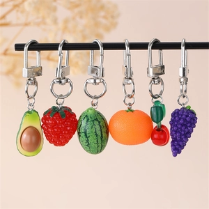 Set of six cute resin fruit keychains featuring avocado strawberry and cherry shapes