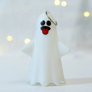 Cute white Halloween ghost ornament with black eyes and red tongue for party decoration