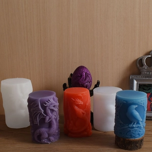 Detailed relief texture of dragon and bird on cylindrical silicone DIY mold for candles