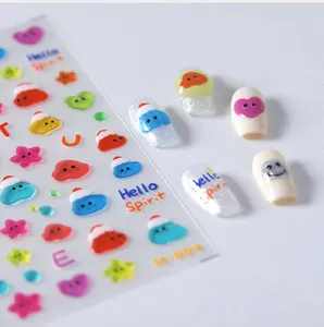 Detailed sheet of cute 3D ghost and heart nail art stickers with applied nail samples