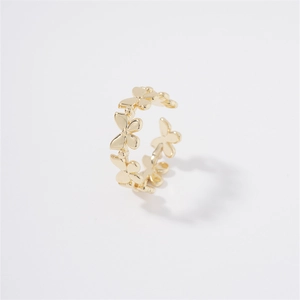 Polished gold floral open ring featuring a continuous four-petal flower wrap design