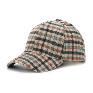 Close-up of houndstooth plaid baseball cap featuring textured wool fabric and curved brim