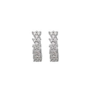 Detailed view of silver hoop earrings with a sparkling zircon wave pattern design