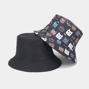 Detail view of reinforced stitching on navy cat print and black cotton bucket hats
