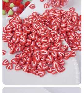 Macro shot of realistic polymer clay strawberry slices for DIY crafts and slime filler